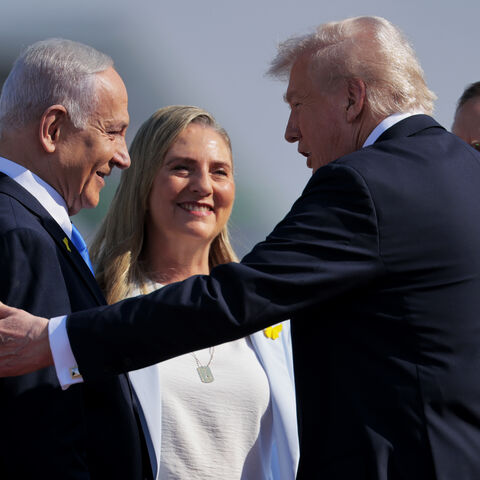 TEL AVIV, ISRAEL - OCTOBER 13: U.S. President Donald Trump (2R) is welcomed by Israeli Prime Minister Benjamin Netanyahu (L) at Ben Gurion International Airport on October 13, 2025 in Tel Aviv, Israel. President Trump is visiting the country hours after Hamas released the remaining Israeli hostages captured on Oct. 7, 2023, part of a US-brokered ceasefire deal to end the war in Gaza. (Photo by Chip Somodevilla/Getty Images)