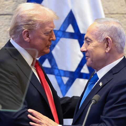 US President Donald Trump speaks with Israeli Prime Minister Benjamin Netanyahu at the Knesset, Israel's parliament, on Oct. 13, 2025, in Jerusalem. 