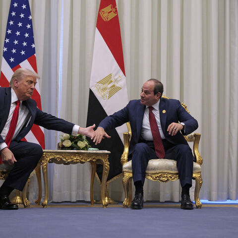 SHARM EL-SHEIKH, EGYPT - OCTOBER 13: U.S. President Donald Trump and President of Egypt Abdel Fattah El-Sisi clasp hands as they speak to the press before their meeting on October 13, 2025 in Sharm El-Sheikh, Egypt. President Trump is in Egypt to meet with European and Middle Eastern leaders in what’s being billed as an international peace summit, following the start of a US-brokered ceasefire deal to end the war in the Gaza Strip. (Photo by Chip Somodevilla/Getty Images)