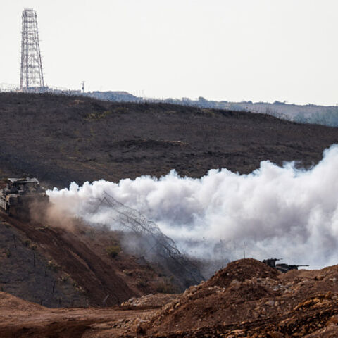 An Israeli military tank patrols along the border fence separating northern Israel from southern Lebanon on November 24, 2025. Hezbollah held the funeral on November 24 for its top military chief and other members of the militant group a day after Israel killed them in a strike on Beirut's southern suburbs. (Photo by Jalaa MAREY / AFP via Getty Images)