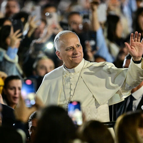 Pope Leo XIV waves to a crowd of youths upon his arrival at the Maronite Patriarchate in Bkerke, north of the capital Beirut, on December 1, 2025. Leo prayed for peace in Lebanon and the region on December 1 on day two of his trip to the multi-confessional country, with joyful Lebanese welcoming the pontiff at two famous pilgrimage sites. (Photo by Giuseppe CACACE / AFP via Getty Images)