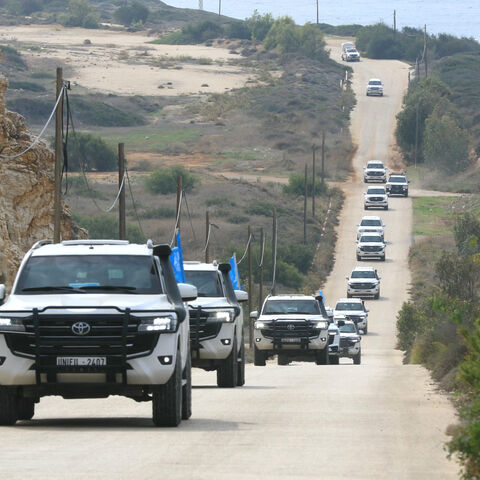 A convoy carrying a UN security council delegation, tours the border with Israel close to the southern Lebanese area of Naqura on December 6, 2025. UNIFIL peacekeepers have been tasked with acting as a buffer between Israel and Lebanon since March 1978, and with monitoring the November 2024 ceasefire that sought to halt more than a year of hostilities between Israel and Hezbollah. (Photo by Mahmoud ZAYYAT / AFP via Getty Images)