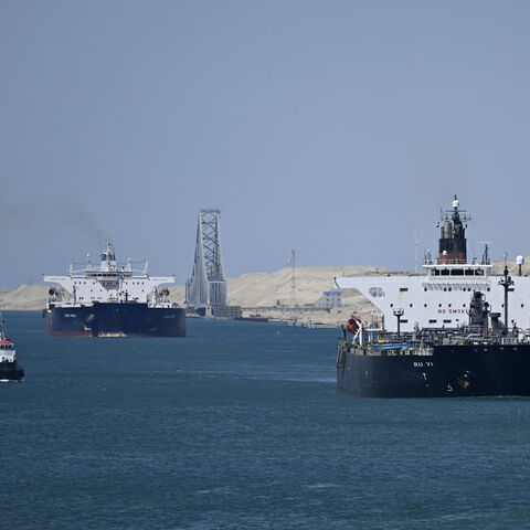 Ships sail along Egypt's Suez Canal near Ismailia on April 16, 2025. 