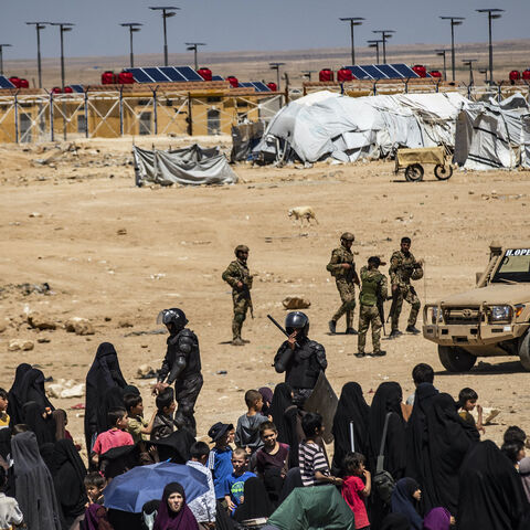 Members of the Syrian Kurdish Asayish security forces gather at the Kurdish-run al-Hol camp, which holds relatives of suspected Islamic State (IS) group fighters in the northeastern Hasakeh governorate, on April 18, 2025, as the Syrian Democratic Forces mount a security campaign against IS "sleeper cells" in the camp.
