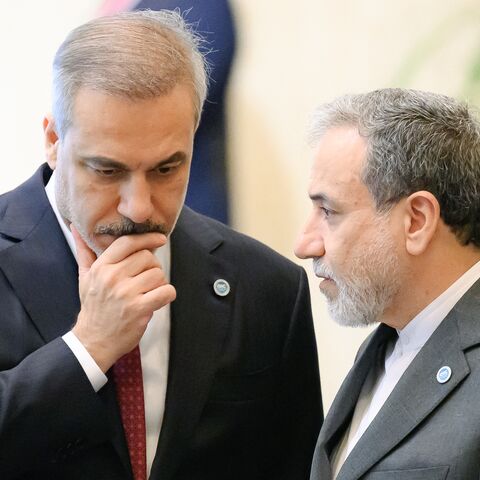 Iranian Foreign Minister Abbas Araghchi (R) speaks with Turkish Foreign Minister Hakan Fidan (L) during the 51st session of the Council of Foreign Ministers of the Organization of Islamic Cooperation in Istanbul, on June 21, 2025.