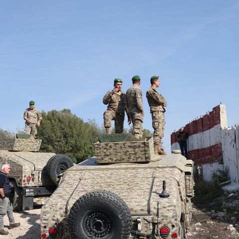 This photograph taken during a press tour organized by the Lebanese army shows Lebanese soldiers standing atop military vehicles in Alma Al-Shaab, near the border with Israel in southern Lebanon, on Nov. 28, 2025. 
