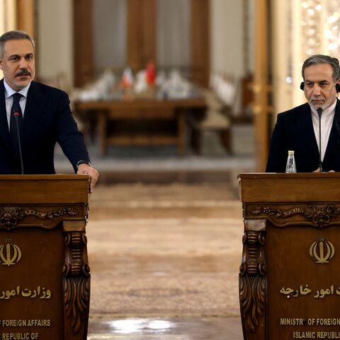 Turkey's Foreign Minister Hakan Fidan (L) and Iran's Foreign Minister Abbas Araghchi holds a joint press conference in Tehran, on Nov. 30, 2025.