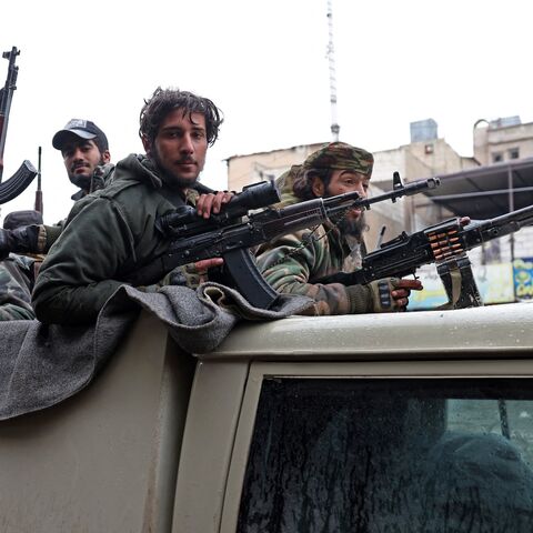 Syrian government troops patrol the streets of Tabqa, in Raqqa province, on the southwestern banks of the Euphrates, Jan. 18, 2026.