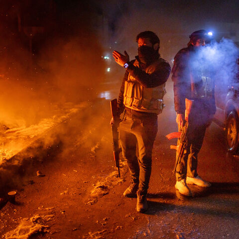 Kurdish security forces patrol the street on Jan. 23, 2026 in Qamishli, Syria. 