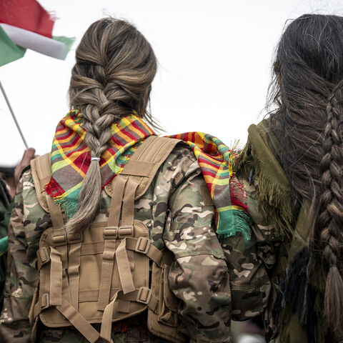 A woman with braided hair during a solidarity demonstration in Erbil, Iraq's Kurdistan region, on Jan. 23, 2026. 