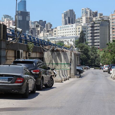 A picture shows a view of a street with access to a detention center under the Adliyeh (Palace of Justice) bridge (L) of Lebanon's capital Beirut, on Aug. 7, 2022.