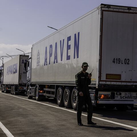 Several trucks carrying humanitarian aid cross the border between Armenia and Turkey at the village of Margara, Armenia, on March 21, 2025. 