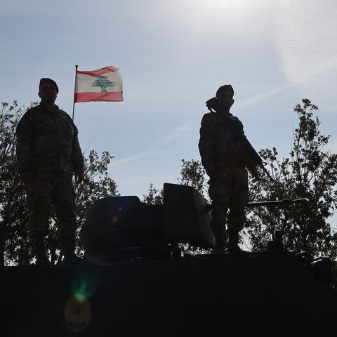 Lebanese soldiers standing atop a military vehicle in Alma Al-Shaab, near the border with Israel in southern Lebanon, on Nov. 28, 2025. 