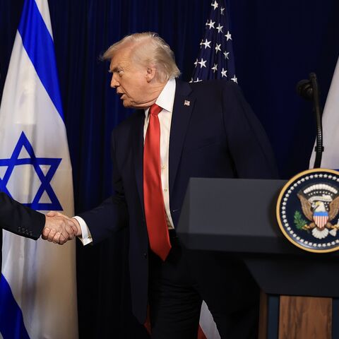 US President Donald Trump shakes hands with Israeli Prime Minister Benjamin Netanyahu during a press conference at his Mar-a-Lago club on Dec. 29, 2025, in Palm Beach, Florida.