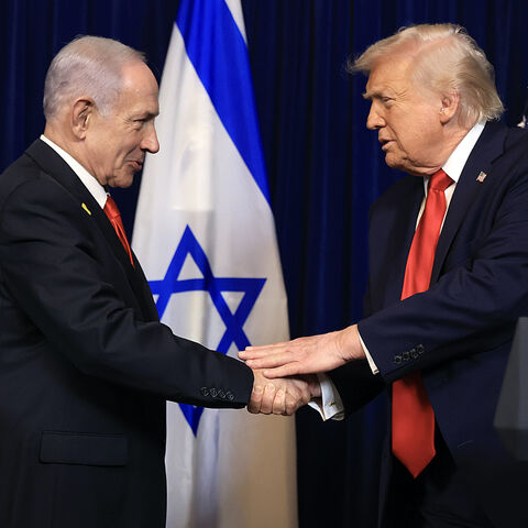 US President Donald Trump shakes hands with Israeli Prime Minister Benjamin Netanyahu during a press conference at his Mar-a-Lago club on Dec. 29, 2025 in Palm Beach, Florida. 