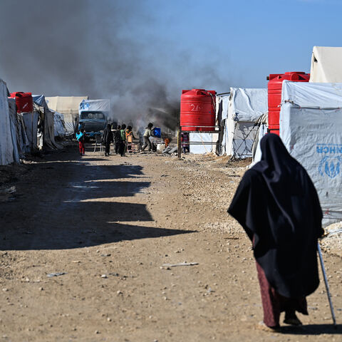 A campfire burns inside al-Hol camp on Jan. 26, 2026 in Al Hasakah, Syria. 