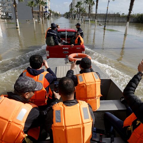 An emergency vehicle drives through flood waters as residents are evacuated and relocated to other towns as preventive and emergency evacuations are carried out to move residents living near flood-prone areas following the weather alert and the rise in the water level of the Loukkos River, with flooding expected in the coming days, in Ksar El Kebir on Feb. 1, 2026. 