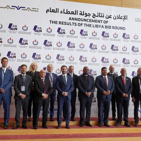 Masoud Suleman, acting chairman of Libya's National Oil Corporation, and other corporate representatives pose for a photo during a conference announcing the first new grants of oil exploration and production licenses in 17 years, in Libya's capital, Tripoli, on Feb. 11, 2026. 