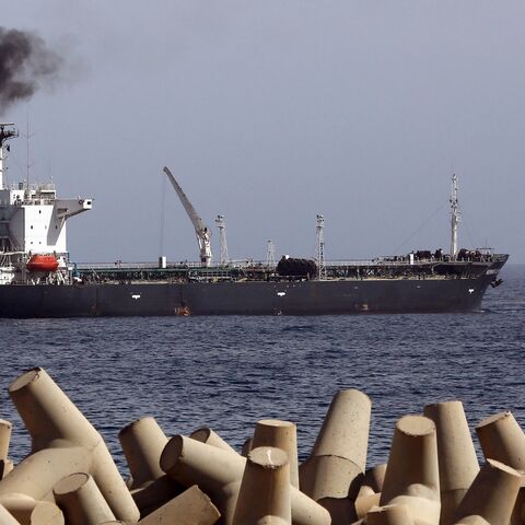 A general view taken on April 4, 2014, shows oil tanker Morning Glory, during the unloading of oil in the Libyan seaport of Zawiya. 