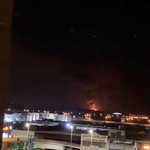 Smoke and fire rise in the direction of the fuel tank at Kuwait International Airport, following a drone strike amid the U.S.-Israeli conflict with Iran, in Al-Dajeej, Kuwait, March 25, 2026, in this still image obtained from a social media video. Social Media/via REUTERS