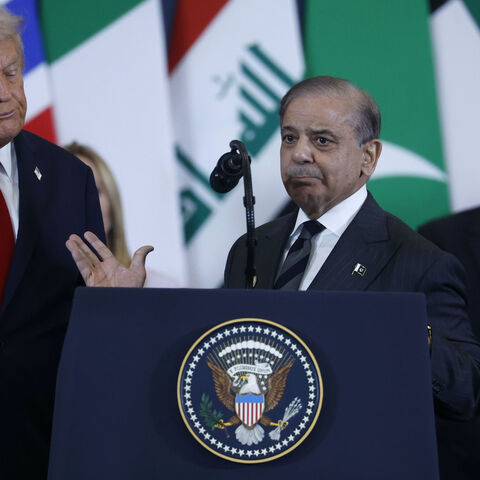 Pakistan's Prime Minister Shehbaz Sharif (C) speaks as US President Donald Trump (L) and Britain's Prime Minister Keir Starmer (R) watch during the Sharm El-Sheikh Peace Summit on Oct. 13, 2025 in Sharm El-Sheikh, Egypt.  