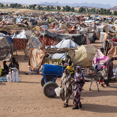 Displaced Sudanese who fled El-Fasher after the city fell to the Rapid Support Forces (RSF), walk in the Um Yanqur camp, located on the southwestern edge of Tawila, in war-torn Sudan's western Darfur region on November 3, 2025. (Photo by AFP) (Photo by -/AFP via Getty Images)