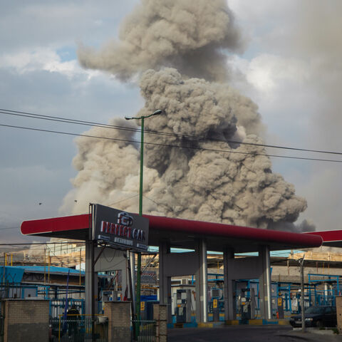 A plume of smoke rises after an explosion on March 2, 2026 in Tehran, Iran. 