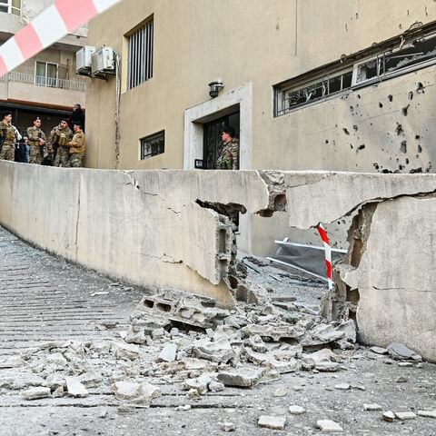 Lebanese soldiers stand at the site where, according to Lebanese authorities, fragments from a missile interception fell in the town of Sahel Alma, north of Beirut, on March 24, 2026. Explosions rocked several areas north of Beirut that have so far been spared in the ongoing Israel-Hezbollah war, according to residents and local media, with a military official saying the blasts likely came from an intercepted Iranian missile. (Photo by FADEL itani / AFP via Getty Images)