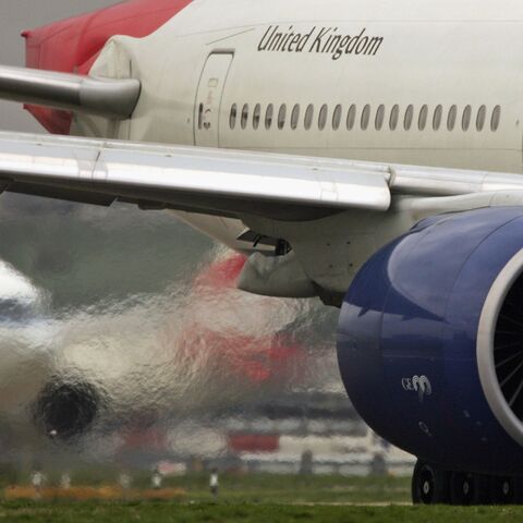 Exhaust emits from the engine of a passenger jet as it prepares for take off at Heathrow Airport on March 30, 2006, in London, England. 