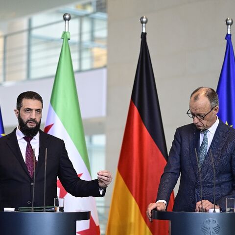 German Chancellor Friedrich Merz (R) and Syrian President Ahmed al-Sharaa address a joint press conference