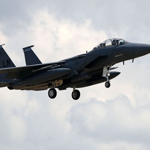 A US Air Force (USAF) F-15E Eagle fighter jet, is pictured as it prepares to land at RAF (Royal Air Force) Lakenheath, east of England, on June 15, 2020. - The UK Coastguard launched a search and rescue operation Monday to find the pilot of a US fighter jet that crashed during a training mission in the North Sea. The US Air Force said the F-15C Eagle went down after taking off from the RAF Lakenheath base near the town of Mildenhall in eastern England. The base is home to the 48th Fighter Wing, which has op