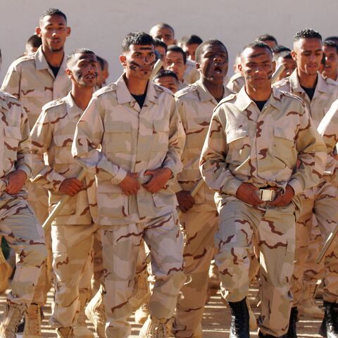 Cadets of the Saiqa Force (Special Forces) of the self-styled Libyan National Army affiliated with eastern strongman Khalifa Hifter take part in a graduation ceremony in tribute to the force's late commander, Wanis Bukhamada, in the eastern city of Benghazi, on Jan. 20, 2022. 