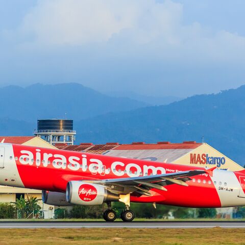 AirAsia aircraft with two engines landing on Kota Kinabalu International airport runway, Kota Kinabalu Sabah, Malaysia, March 4, 2017.