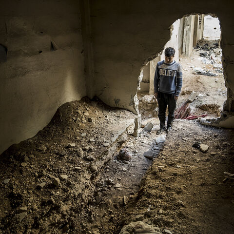A young man stands in the entrance of tunnels that were used by the ISIS and the Assad's regime for fighting. Tadamon, Syria, February 7, 2025. (Photo by Raghed Waked / Middle East Images / Middle East Images via AFP) (Photo by RAGHED WAKED/Middle East Images/AFP via Getty Images)