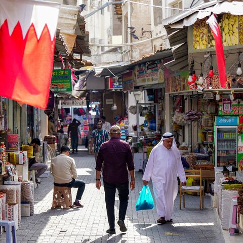 People walk along an alley at a bazaar in Bahrain's capital, Manama, on March 11, 2026. 