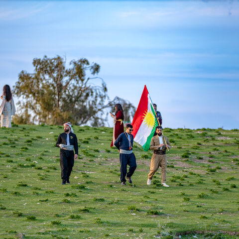Kurdish people waving Kurdistan flags gather to celebrate Nowruz on the hill of Urkesh in the countryside of Amuda in northeastern Syria on March 18, 2026. Nowruz, meaning "new day," is an ancient festival that marks the start of spring and the new year on the vernal equinox, which usually falls on March 20 or 21. It is celebrated by more than 300 million people worldwide and has been observed for over 3,000 years across regions including the Middle East, Central Asia, the Caucasus and parts of Eastern Euro