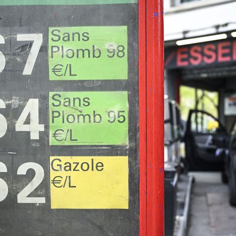 This photograph shows a sign displaying the daily price panel for SP98, SP95 and diesel at a gas station in Paris on April 2, 2026. 