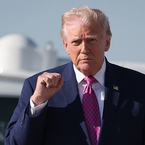 President Donald Trump walks toward reporters before answering questions before boarding Air Force One on April 10, 2026, at Joint Base Andrews, Maryland.