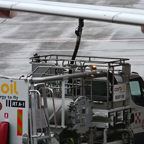 A fuel truck CarbOil services an Easyjet aircraft at Milan's Malpensa Airport on April 13, 2026. 