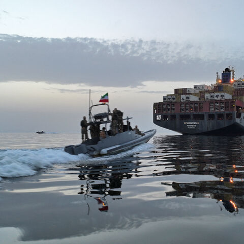 This photo obtained by AFP from the Iranian news agency Tasnim shows an Islamic Revolutionary Guard Corps (IRGC) boat allegedly taking part in an operation to seize ships attempting to cross the Strait of Hormuz, on April 21, 2026. 