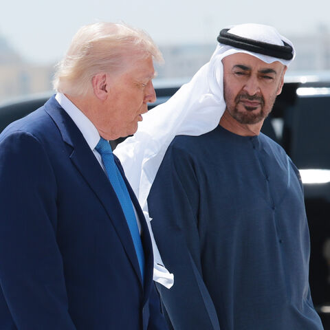 US President Donald Trump talks to UAE President Sheikh Mohamed bin Zayed Al Nahyan as he departs the Al Bateen Executive Airport on May 15, 2025, in Abu Dhabi, United Arab Emirates. 
