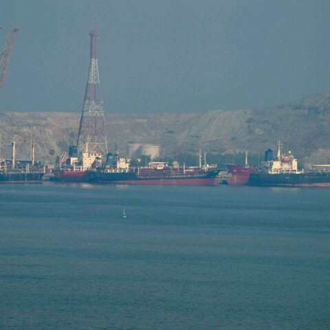 Tankers are seen at the Khor Fakkan Container Terminal in the Sharjah Emirate, along the Strait of Hormuz on June 23, 2025. (Photo by Giuseppe CACACE / AFP) (Photo by GIUSEPPE CACACE/AFP via Getty Images)