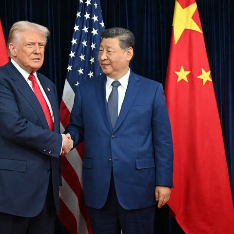 US President Donald Trump and Chinese President Xi Jinping shake hands as they arrive for talks at the Gimhae Air Base in Busan, South Korea, on Oct. 30, 2025.