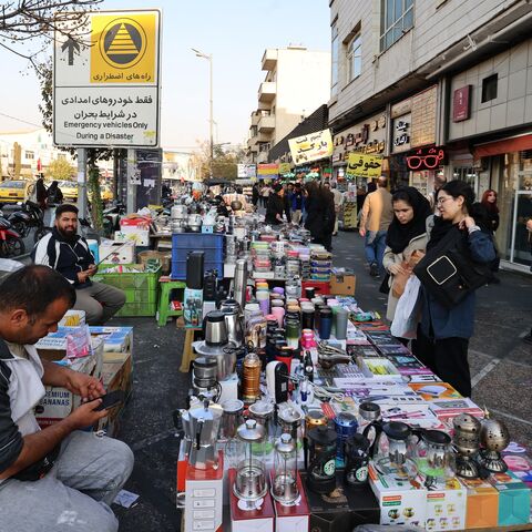 Women shop from a street vendor at Enghelab Square in the capital Tehran on Nov. 11, 2025. 
