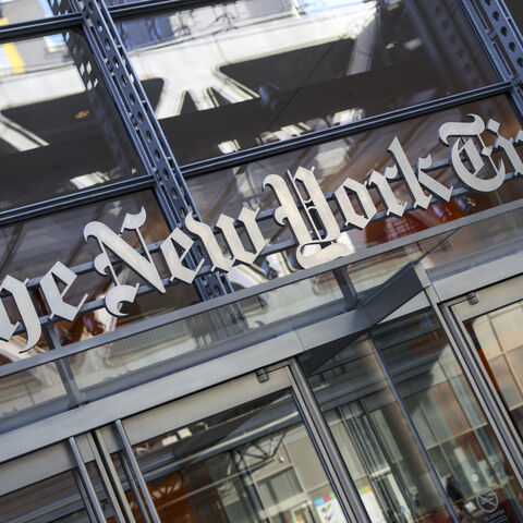 The New York Times logo is seen on the building's facade in New York City on January 22, 2026. US President Donald Trump announced today he will sue The New York Times over an unfavorable opinion poll and suggested that what he called "fake" surveys should criminalized. Trump lashed out after publication of a New York Times/Siena University poll finding only 40 percent approval for the 79-year-old Republican -- in line with multiple other polls showing declining support a year into his second term. (Photo b