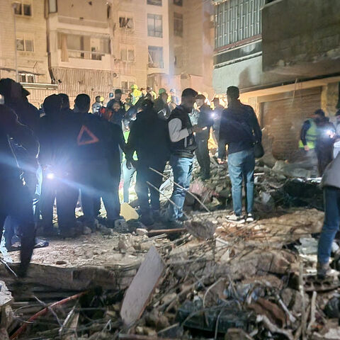 People gather at the site of an Israeli airstrike that targeted Beirut's southern suburbs neighborhood of Haret Hreik on May 6, 2026.