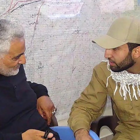 An undated image released by the Justice Department shows Mohammad Baqer Saad Dawood al-Saadi (R) speaking with Iranian Quds Force Commander Qasem Soleimani, who was killed in a US strike in 2020.