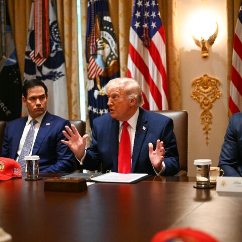 US Secretary of the Interior Doug Burgum (L), US Secretary of State Marco Rubio (2nd L) and US Defense Secretary Pete Hegseth (R) listen to US President Donald Trump (C) weigh options on Iran in a cabinet meeting