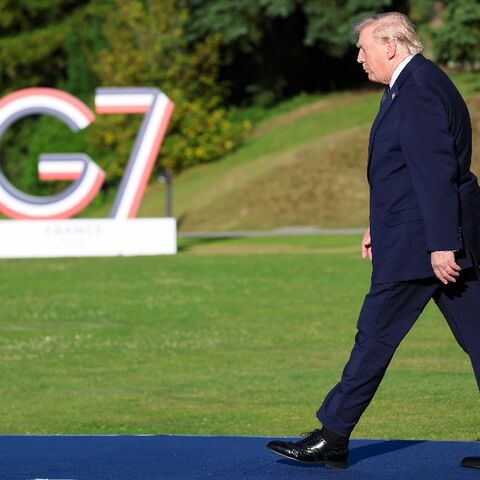 US President Donald Trump arrives for the official greeting during the G7 summit, in Evian, eastern France