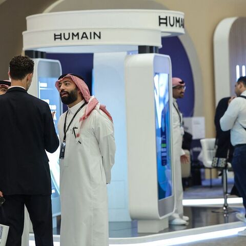 Guests stand at the booth of Saudi artificial intelligence company Humain during the Future Investment Initiative conference in Riyadh on Oct. 29, 2025. — FAYEZ NURELDINE/AFP via Getty Images